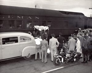Patients arriving by train for Kaiser physical therapy, 1948