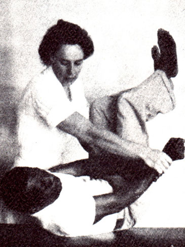 1951 image of a female nurse with a male patient