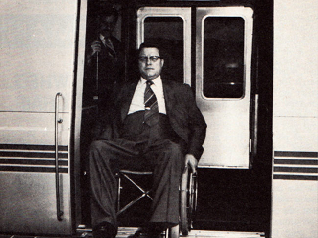 Harold Willson, Kaiser Permanente employee from 1957 to 1977, getting off a wheelchair-accessible BART train. Willson convinced officials to alter the system design to accommodate disabled passengers.