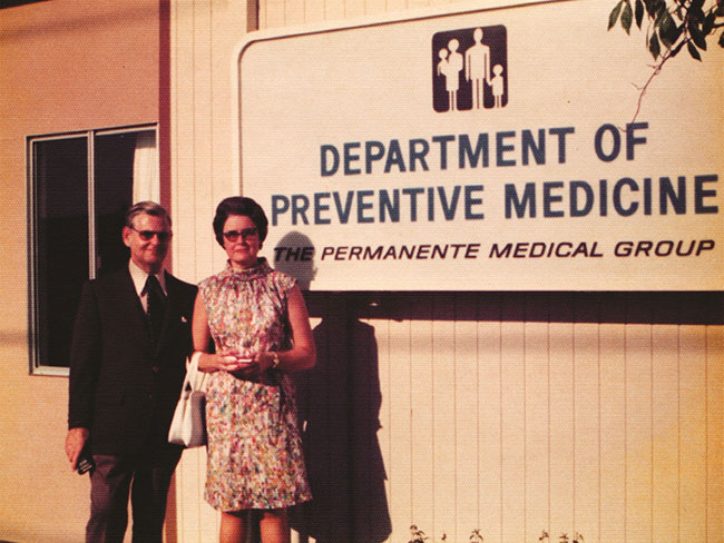 man and woman standing in front of sign that reads: Department of Preventative Medicine