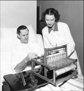Historical photo of Mine worker patient at Kaiser Permanente Vallejo Rehabilitation Hospital using a laptop loom for occupational therapy.