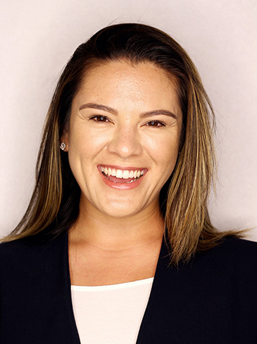 woman dressed professionally and smiling
