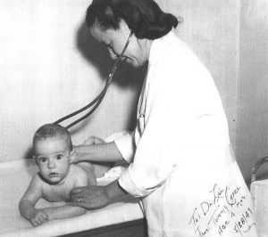 1947 image of Kaiser Permanente physician Beatrice Lei, MD, with infant patient.