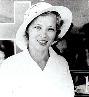 smiling nurse wearing a hard hat