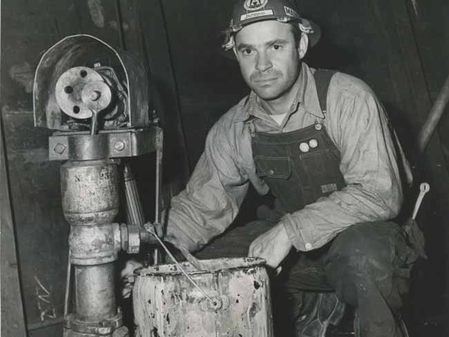 Maintenance worker with pump, "Labor Management", Kaiser Richmond shipyard No. 4, circa 1943 