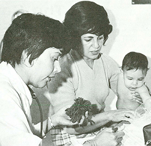 nurse with mother and baby