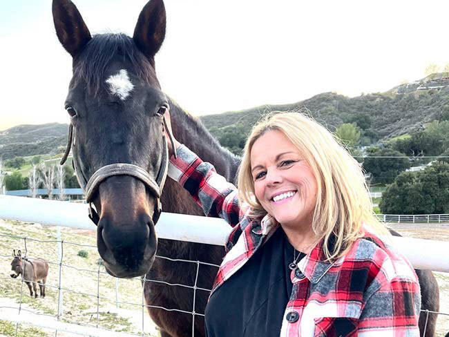 Valerie Dionne poses with a horse