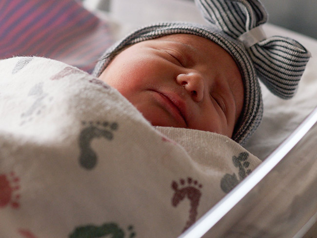 swaddled newborn