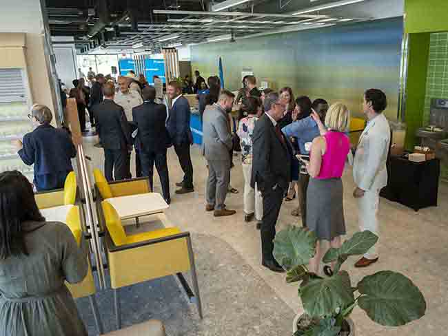 people gathering at the grand opening