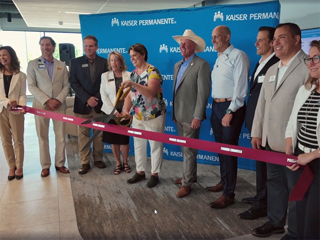 leaders gather for ribbon cutting ceremony