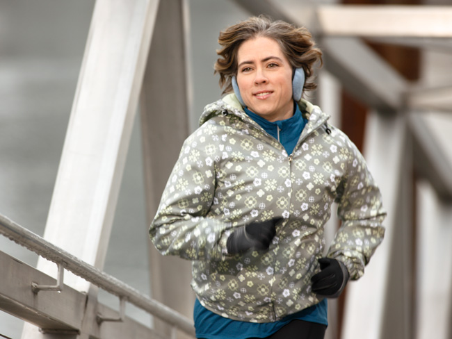 woman jogging dressed in cold weather clothing