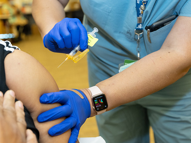 Nurse administering the COVID-19 vaccine 