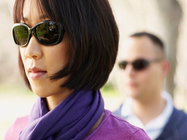 Asian woman in dark glasses