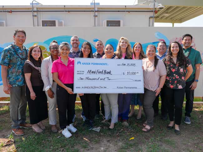 Lahaina Clinic team members  holding a giant check for $10,000