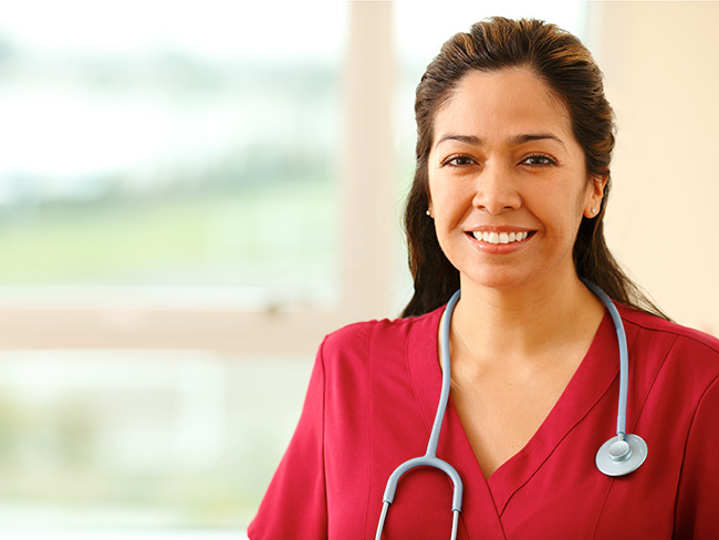 Smiling nurse with a stethoscope around her neck