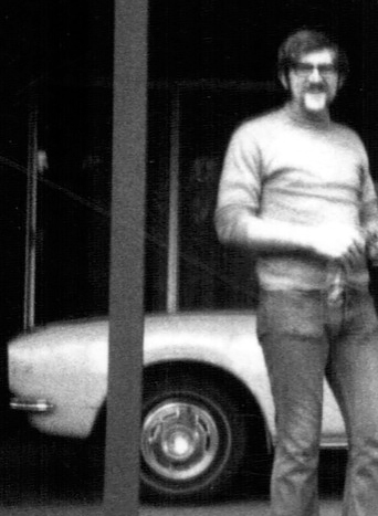 Man standing by a car