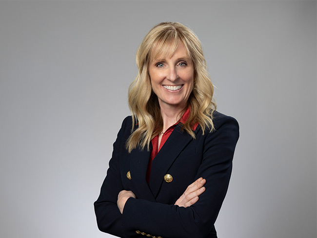 Wendy Watson, resident of Kaiser Foundation Health Plan and Hospitals of the Northwest, a pretty blond, middle-aged woman smiling into the camera.