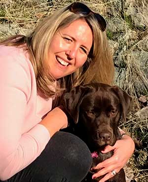 Mariann Stephens and her chocolate labrador retriever Cali