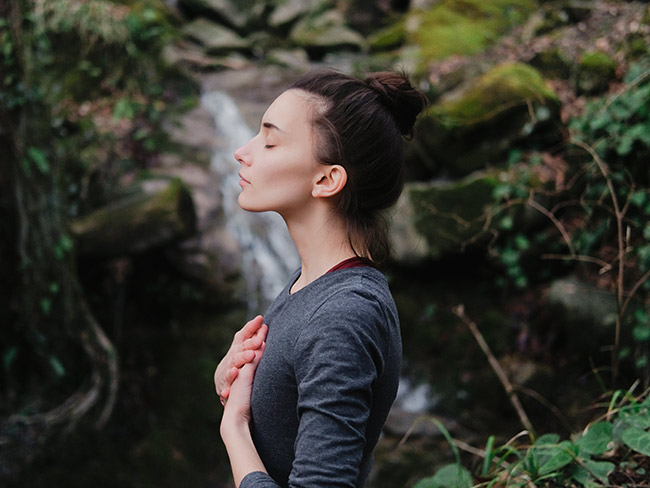 Young woman practicing breathing