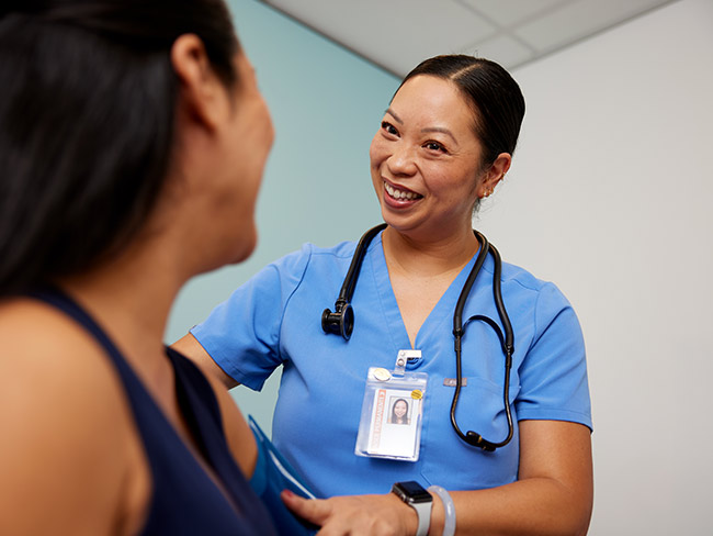 Nurse smiling at a patient