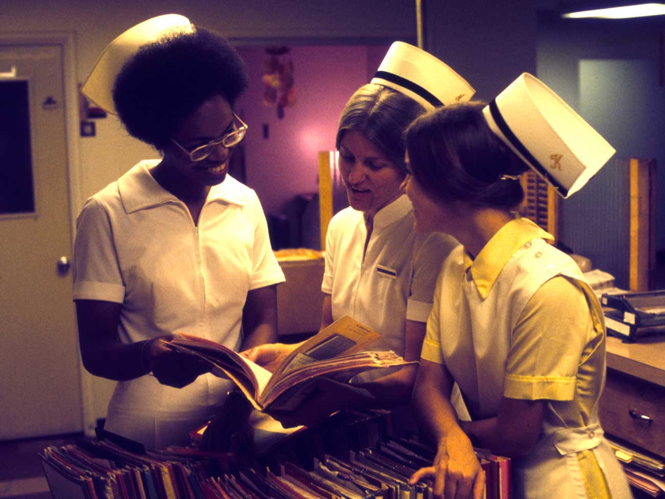 vintage photograph of 3 women wearing 1960s era nursing uniforms