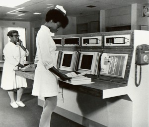 Nurses use monitoring system in cardiac care unit, circa 1965