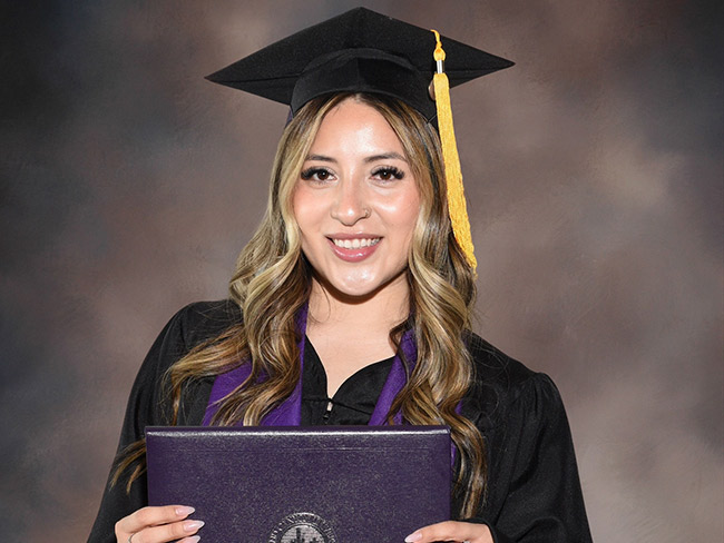 Photo of Karen Torres in her graduation gown