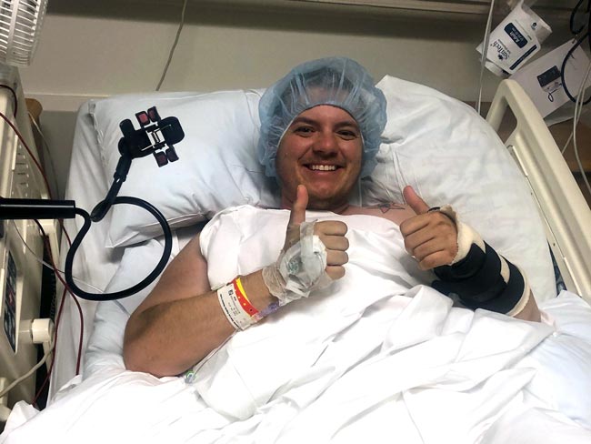 Ollie Zirbel gives the thumbs up while recovering from surgery