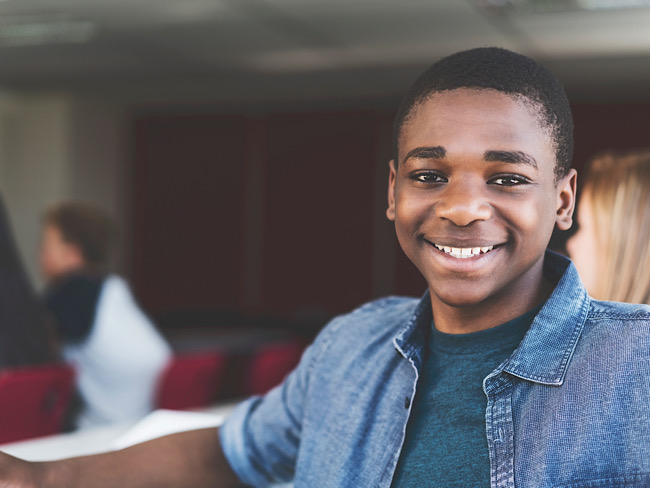 Black teen boy smiling
