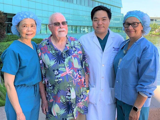 Kaiser Permanente member Hal Croulet surrounded by care team