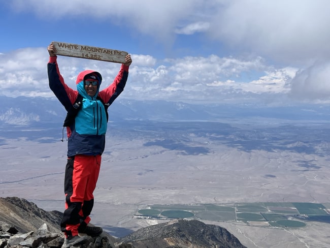 Chris Hogan standing atop White Mountain Peak