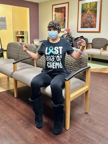 Miriam Gutierrez wearing a shirt that reads "last day of chemo"