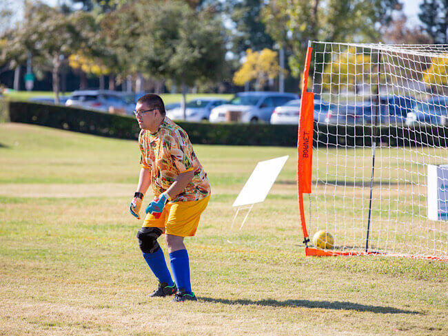 Special Olympics athlete playing soccer
