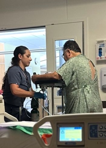 doctor working with patient in hospital