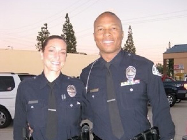 Kidney donor Sara and recipient and husband Robert Norman in their LAPD uniforms