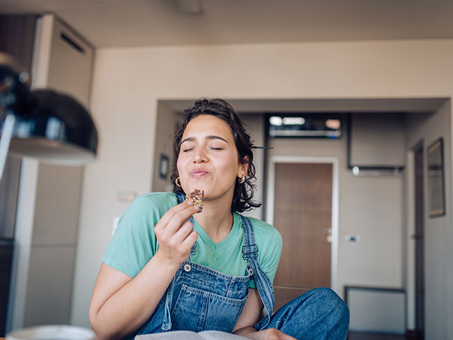 Woman enjoying a apple spice oatmeal cake