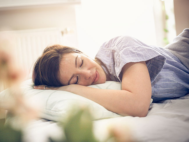 Woman sleeping on her side.