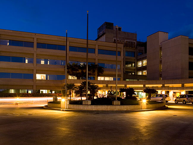 exterior of hospital entrance at night