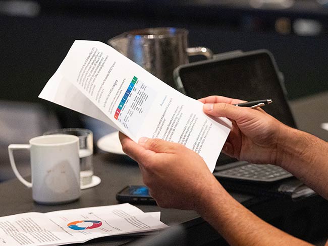 A bargaining representative thumbs through the last Alliance national contract.