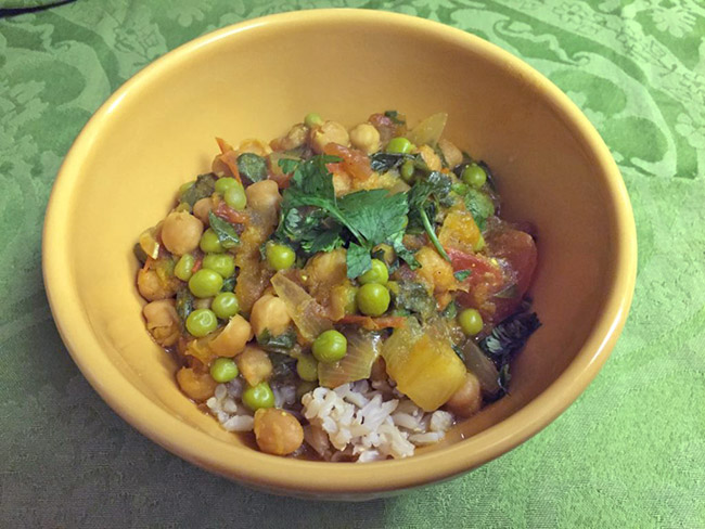 A hearty bowl of butternut squash and chickpea coconut curry over rice.
