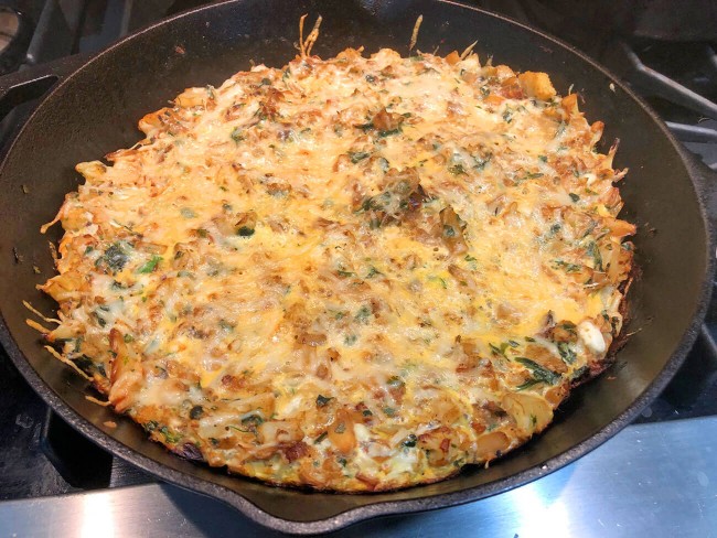 Kuku, a Persian cauliflower and herb frittata, in a cast-iron skillet.