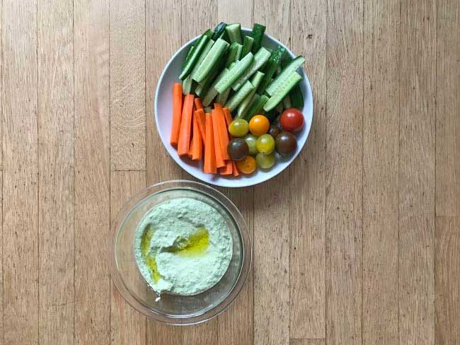 edamame-hummus served with carrots, cucumber and grapes