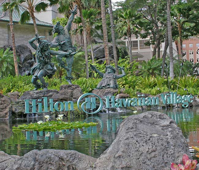 hotel garden with statues of native Hawaiians 
