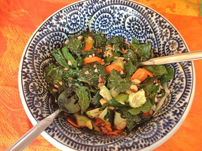 Kale market salad served in a blue bowl