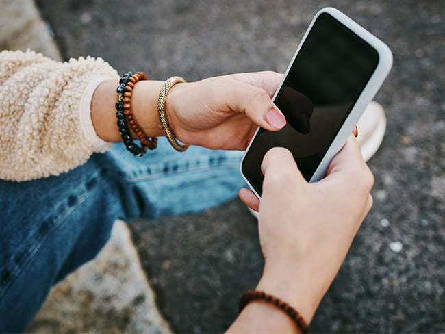 Person looking at mobile looking for help