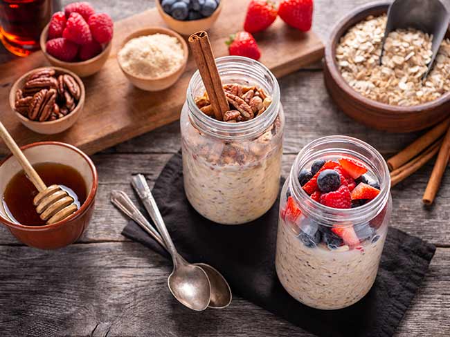 Jars of overnight oats with berries and nuts