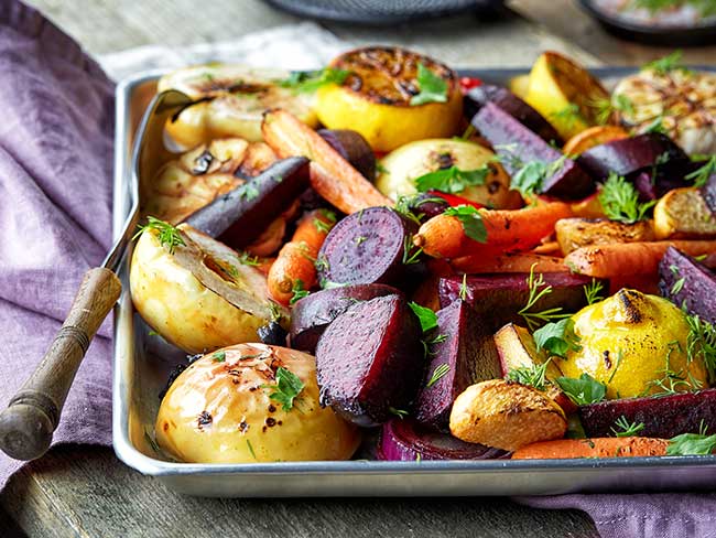 pan caramelized vegetables on a metal baking tray